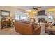 Living room with hardwood floors, fireplace and leather sofas at 2241 Heron Circle, Clearwater, FL 33762