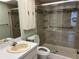 Clean bathroom with updated shower, toilet, and vanity at 2251 Spruce Ln # A, Palm Harbor, FL 34684