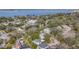 Aerial view showing home's location in a tree-lined neighborhood near the water at 229 Lime S Cir, Dunedin, FL 34698