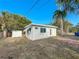 House exterior view with shed and walkway at 229 Lime S Cir, Dunedin, FL 34698