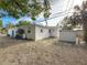 Side yard view with shed and landscaping at 229 Lime S Cir, Dunedin, FL 34698