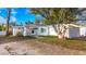 Charming single story home with mature landscaping and driveway at 229 Lime S Cir, Dunedin, FL 34698