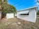 Rear exterior showing shed and brick walkway at 229 Lime S Cir, Dunedin, FL 34698