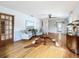 Living room features hardwood floors, a cowhide rug, and built-in shelving at 229 Lime S Cir, Dunedin, FL 34698