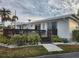 White single story home with deck and landscaped yard at 236 Carol Dr # 236, Seminole, FL 33772