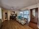 Bright living room with comfy couch and wood floors at 236 Carol Dr # 236, Seminole, FL 33772