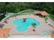 Community pool with surrounding lounge chairs and umbrellas at 25237 Seven Rivers Cir, Land O Lakes, FL 34639