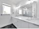 Modern bathroom with double vanity and marble countertops at 2608 W Columbus Dr # 5, Tampa, FL 33607