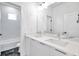 Bathroom with double vanity, quartz countertop and bathtub at 2608 W Columbus Dr # 5, Tampa, FL 33607