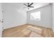 Bright bedroom with light wood floors, ceiling fan, and window blinds at 2608 W Columbus Dr # 5, Tampa, FL 33607