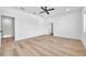 Bright bedroom with light wood floors and ceiling fan at 2608 W Columbus Dr # 5, Tampa, FL 33607