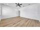 Spacious bedroom featuring hardwood floors and a ceiling fan at 2608 W Columbus Dr # 5, Tampa, FL 33607