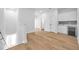 Light-filled hallway with wood floors, leading to bedrooms and other rooms at 2608 W Columbus Dr # 5, Tampa, FL 33607