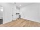 Modern hallway with light wood floors and built-in wet bar at 2608 W Columbus Dr # 5, Tampa, FL 33607