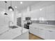 Modern kitchen with white cabinets and marble countertops at 2608 W Columbus Dr # 5, Tampa, FL 33607