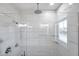 Large walk-in shower with marble tile and glass enclosure at 2608 W Columbus Dr # 5, Tampa, FL 33607