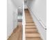 Modern light oak stairs with white railings at 2608 W Columbus Dr # 5, Tampa, FL 33607