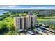 High-rise condo building near golf course and water at 2616 Cove Cay Dr # 102, Clearwater, FL 33760