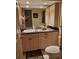 Well-appointed bathroom with updated vanity and granite countertop at 2616 Cove Cay Dr # 102, Clearwater, FL 33760