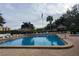 Relaxing community pool with plenty of lounge chairs at 2616 Cove Cay Dr # 102, Clearwater, FL 33760