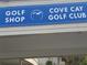 Exterior sign for Cove Cay Golf Club's golf shop at 2616 Cove Cay Dr # 102, Clearwater, FL 33760