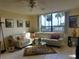 Spacious living room with water views and comfy seating at 2616 Cove Cay Dr # 102, Clearwater, FL 33760