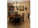 Dining area with a round wooden table and six chairs, featuring a chandelier at 2815 Holly Bluff Ct, Plant City, FL 33566