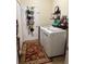 Convenient laundry room with washer, dryer, and storage at 2815 Holly Bluff Ct, Plant City, FL 33566