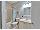 Clean bathroom with a tub, toilet, vanity, and shower at 302 Latitude Pl, Apollo Beach, FL 33572