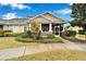 Inviting home exterior with a screened porch at 302 Latitude Pl, Apollo Beach, FL 33572