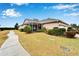 Attractive exterior featuring a screened porch and manicured lawn at 302 Latitude Pl, Apollo Beach, FL 33572