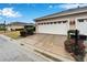 Attached two-car garage with white doors at 302 Latitude Pl, Apollo Beach, FL 33572