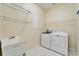 Laundry room with washer, dryer, and utility sink at 302 Latitude Pl, Apollo Beach, FL 33572