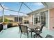 Enjoy relaxing in this screened patio with seating area at 302 Latitude Pl, Apollo Beach, FL 33572