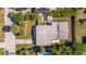 Aerial view of a single-Gathering home with a spacious yard and driveway at 3152 Karen Ave, Largo, FL 33774