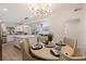 Bright dining area with a round table and modern light fixture at 3152 Karen Ave, Largo, FL 33774