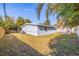 Light blue house exterior with a grassy backyard at 3152 Karen Ave, Largo, FL 33774