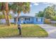 Front view of the light blue house with a driveway at 3152 Karen Ave, Largo, FL 33774