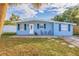 Front view of the light blue house with a driveway at 3152 Karen Ave, Largo, FL 33774