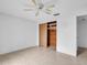 Bedroom with ceiling fan and cedar closet at 3220 Salisbury Dr, Holiday, FL 34691