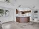 Kitchen features a large island and wood cabinetry at 3220 Salisbury Dr, Holiday, FL 34691