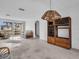 Living room with large windows and vintage wood furniture at 3220 Salisbury Dr, Holiday, FL 34691