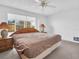 Main bedroom with large bed and backyard view at 3220 Salisbury Dr, Holiday, FL 34691