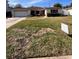 Ranch style home with attached garage and spacious front yard at 3615 S Lightner Dr, Tampa, FL 33629