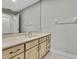 Bathroom with a vanity and a large mirror at 4381 Caliquen Dr, Brooksville, FL 34604