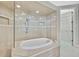 Bathroom with soaking tub and walk-in shower at 4381 Caliquen Dr, Brooksville, FL 34604