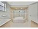 Spa-like bathroom with soaking tub and walk-in shower at 4381 Caliquen Dr, Brooksville, FL 34604