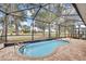 Inviting screened-in pool overlooking a scenic view at 4381 Caliquen Dr, Brooksville, FL 34604