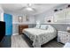 Main bedroom with king-size bed and coastal-themed bedding, plus a blue door at 5421 Circle Dr, Weeki Wachee, FL 34607