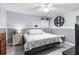 Bedroom with king-size bed, coastal decor, and a ceiling fan at 5421 Circle Dr, Weeki Wachee, FL 34607